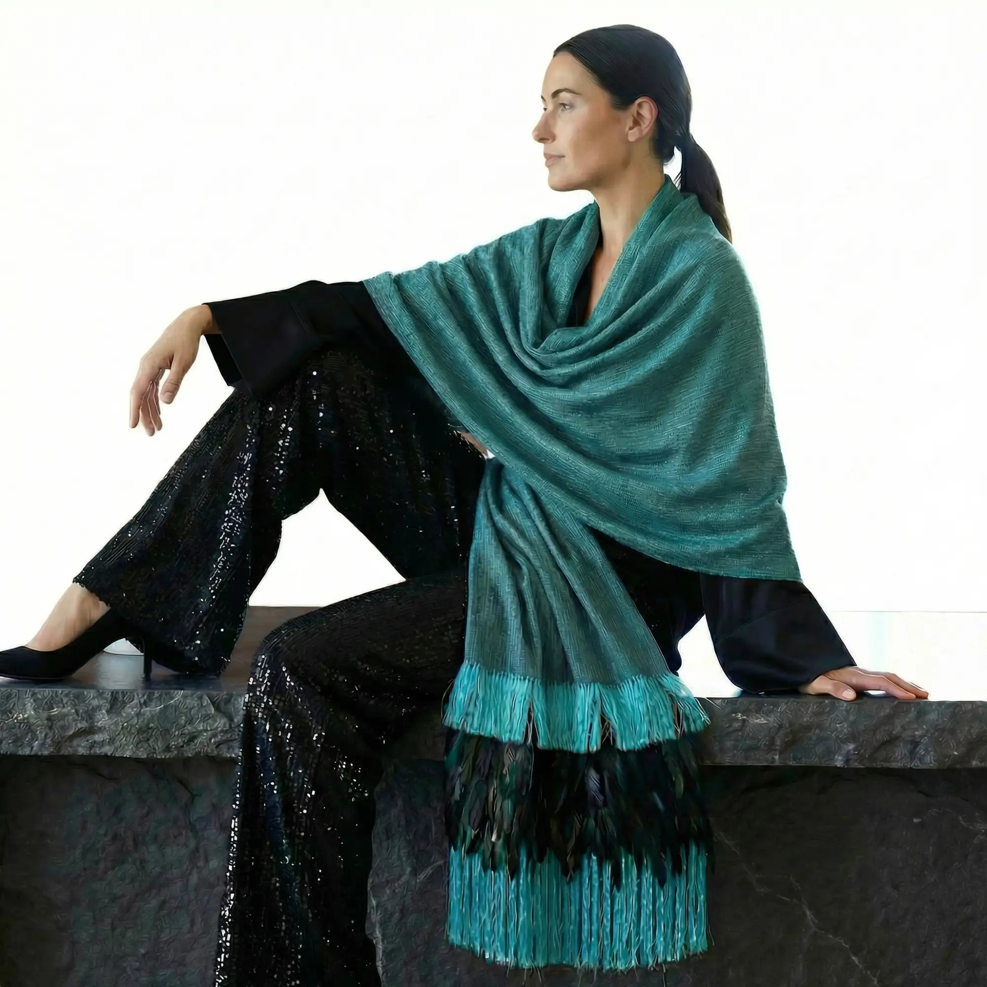 Teal and black fringe shawl with a textured knit body.